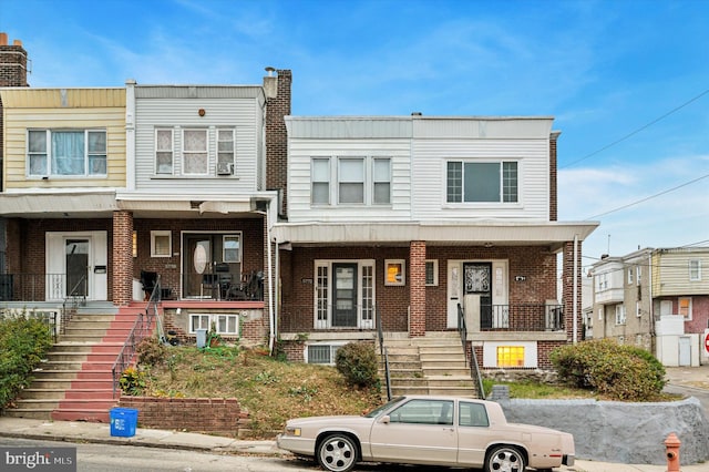 multi unit property featuring a porch