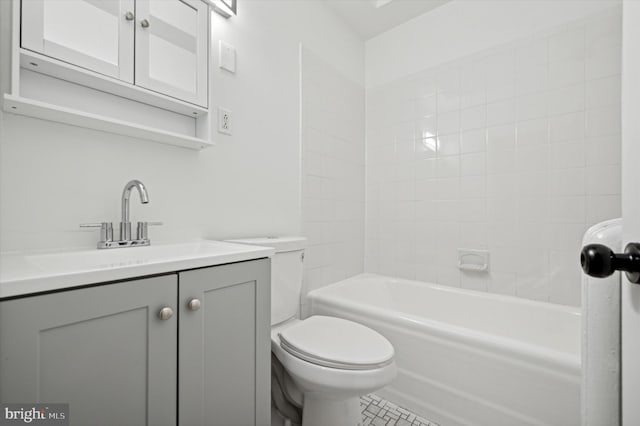 full bathroom featuring tile patterned flooring, vanity, toilet, and tiled shower / bath combo