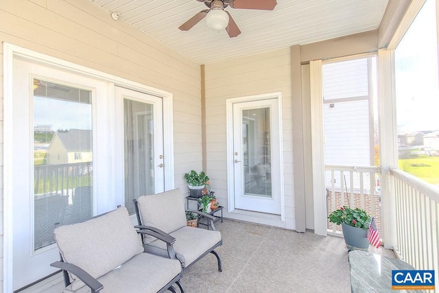 sunroom / solarium featuring ceiling fan