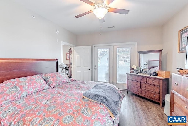 bedroom featuring access to outside, ceiling fan, and light hardwood / wood-style flooring