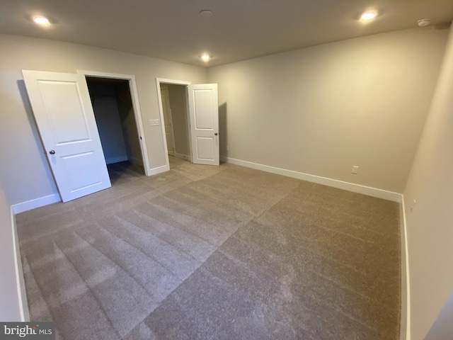 unfurnished bedroom with carpet flooring