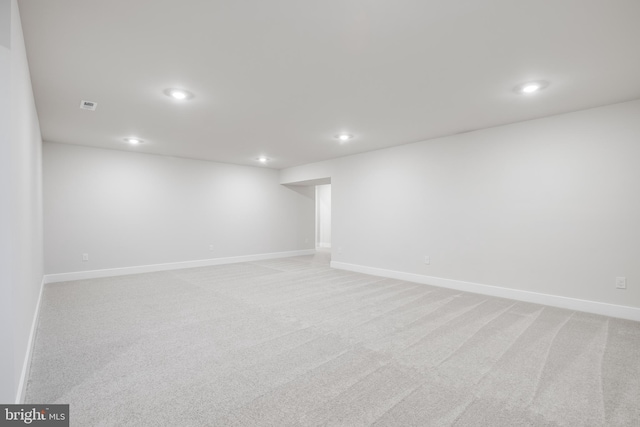 basement with light colored carpet