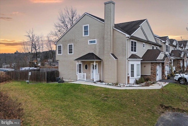 view of front of house with a lawn