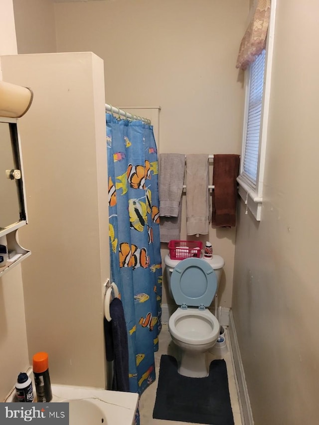 bathroom featuring toilet