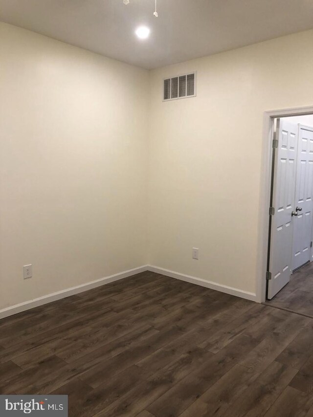 1600 S Taney St, Philadelphia, PA 19145 - unfurnished room with dark wood-style floors and baseboards