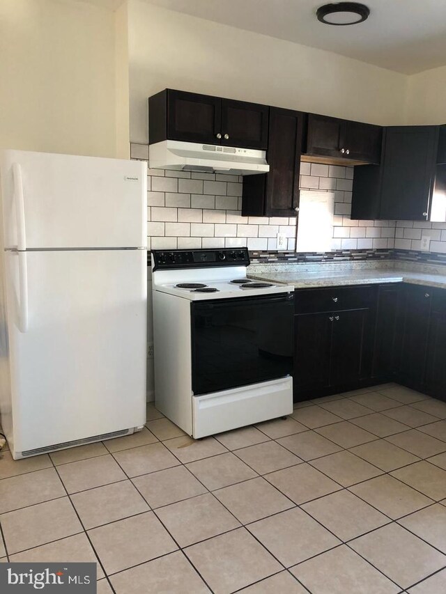 1600 S Taney St, Philadelphia, PA 19145 - kitchen with freestanding refrigerator, range with electric cooktop, tasteful backsplash, light countertops, and light tile patterned floors
