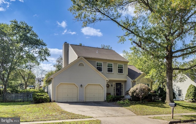 view of front of house featuring a garage and a front lawn