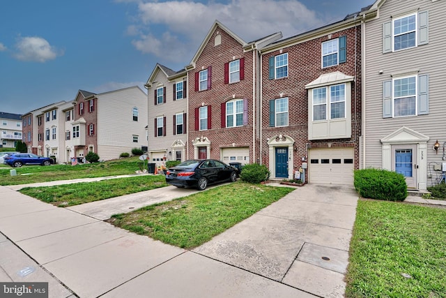 multi unit property featuring a garage and a front lawn