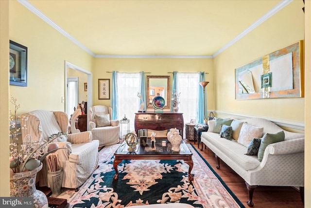 living room with wood-type flooring and ornamental molding