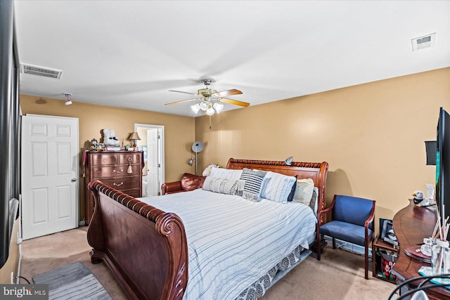 bedroom with light carpet and ceiling fan