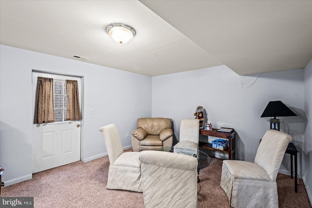 sitting room featuring carpet flooring