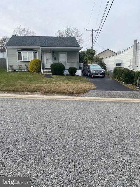 bungalow featuring a front yard and a porch