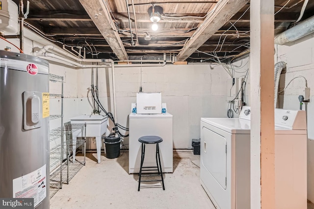 laundry room featuring separate washer and dryer, sink, and water heater