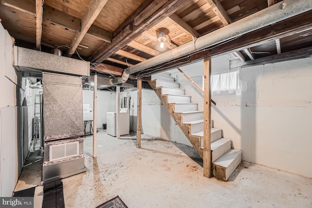 basement with washing machine and clothes dryer