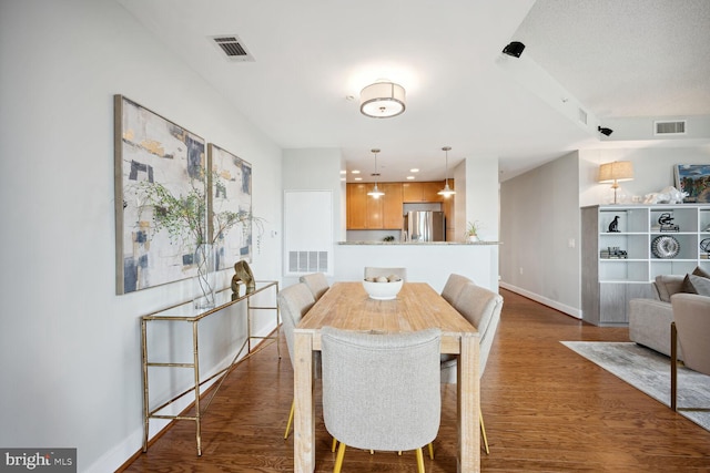 dining area featuring wood-type flooring