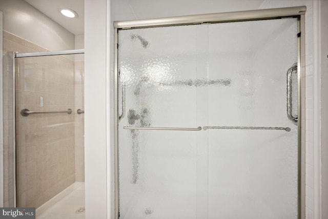 bathroom featuring an enclosed shower