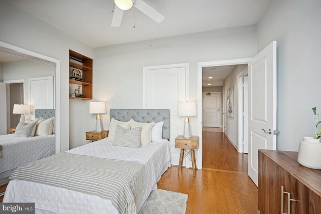 bedroom featuring ceiling fan and light hardwood / wood-style floors