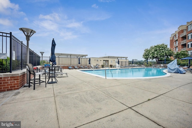 view of swimming pool featuring a patio area