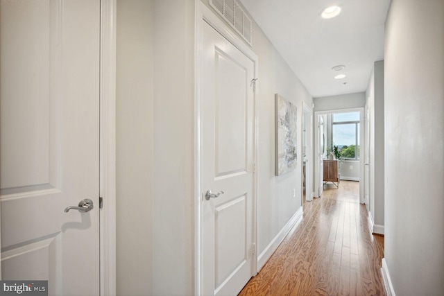 hallway featuring hardwood / wood-style floors