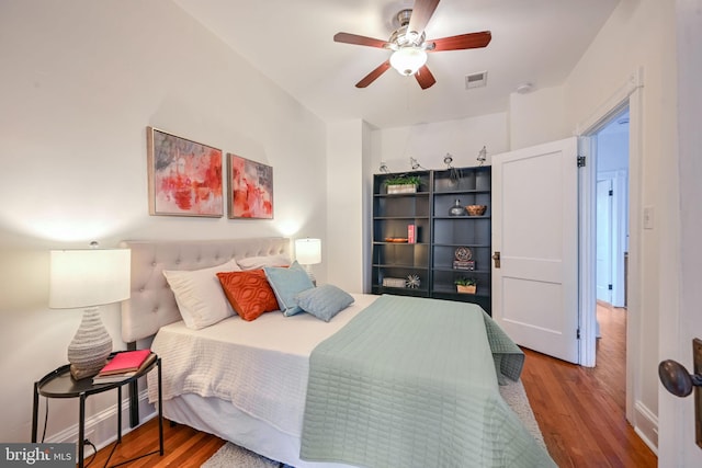 bedroom featuring wood-type flooring and ceiling fan