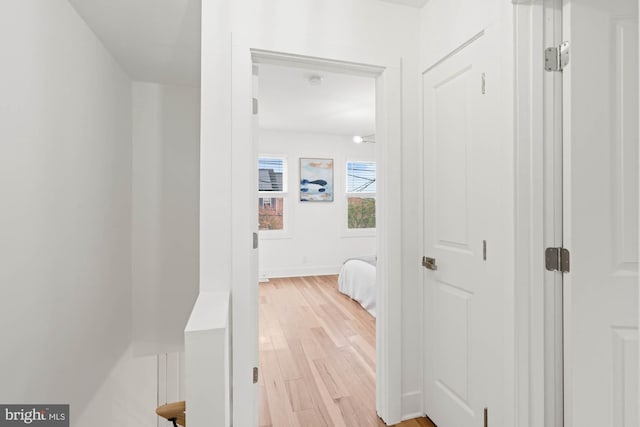 hall with light hardwood / wood-style floors