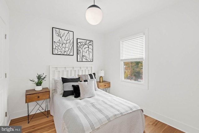 bedroom with wood-type flooring