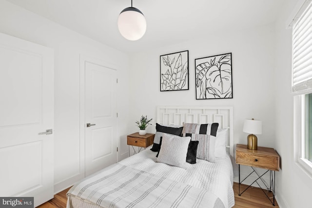 bedroom with hardwood / wood-style floors