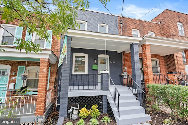 view of property with covered porch