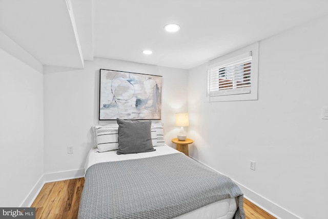 bedroom with wood-type flooring