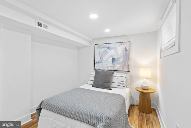 bedroom featuring hardwood / wood-style floors