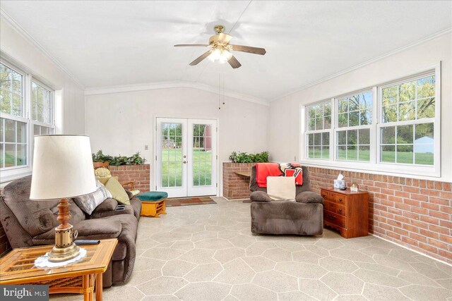 sunroom / solarium featuring french doors, vaulted ceiling, and ceiling fan