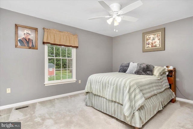 bedroom with ceiling fan and carpet floors