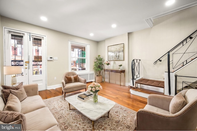 living room featuring radiator and hardwood / wood-style flooring