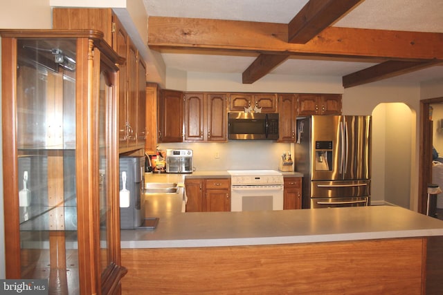 kitchen with beam ceiling, kitchen peninsula, and appliances with stainless steel finishes