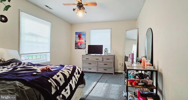 carpeted bedroom with ceiling fan