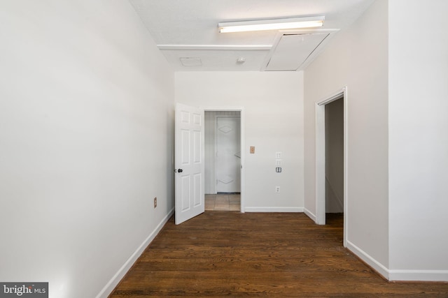 corridor featuring dark hardwood / wood-style floors