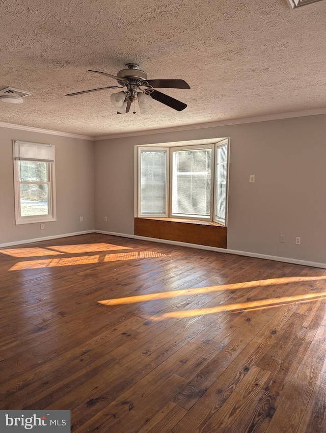 unfurnished room with ornamental molding, ceiling fan, a textured ceiling, and dark hardwood / wood-style flooring