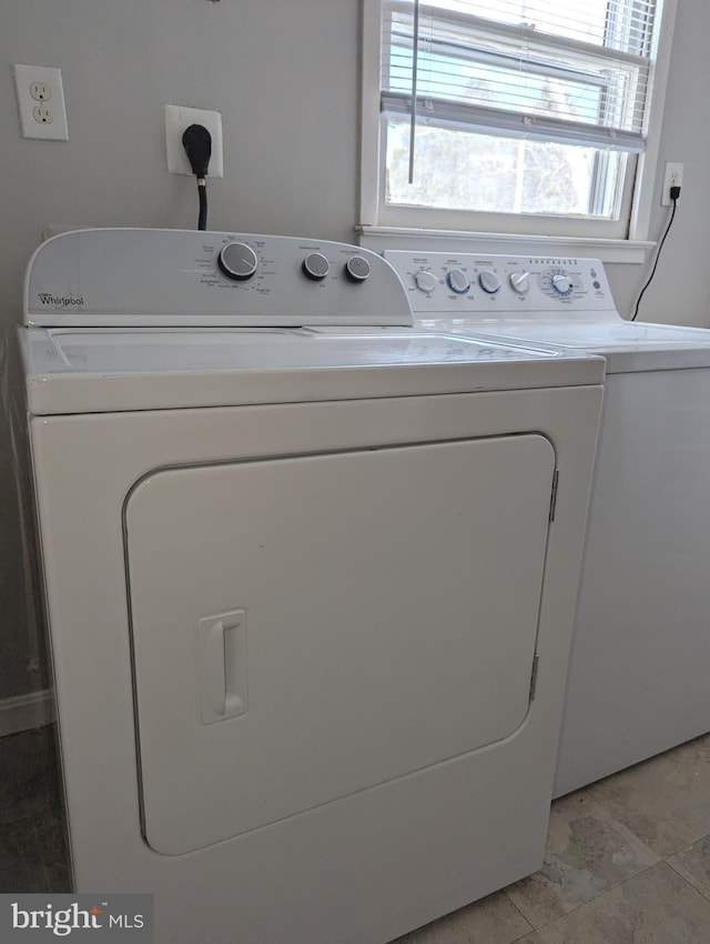 laundry room with washer and dryer