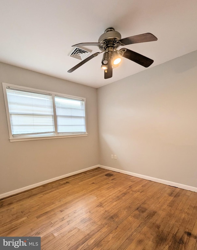 unfurnished room with light wood-type flooring