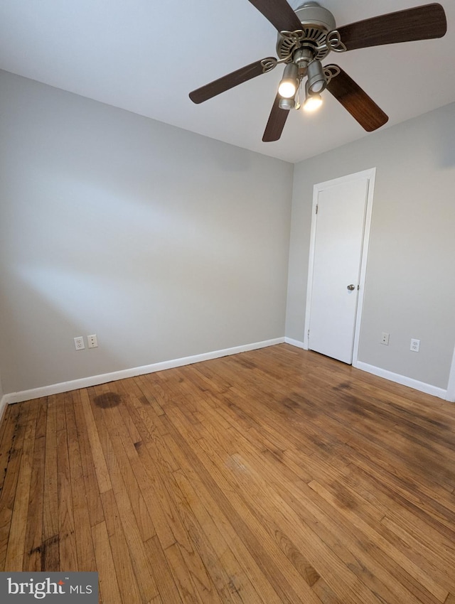 spare room with hardwood / wood-style flooring