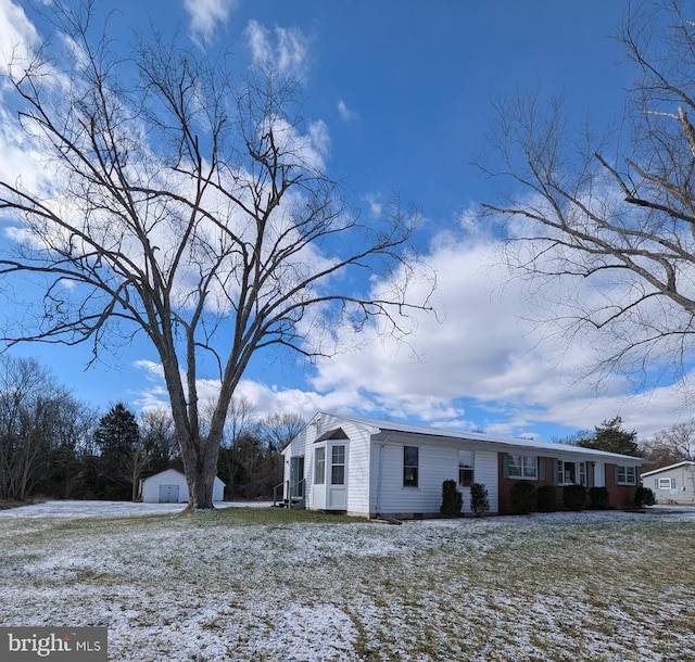 view of front of property featuring an outbuilding and a garage