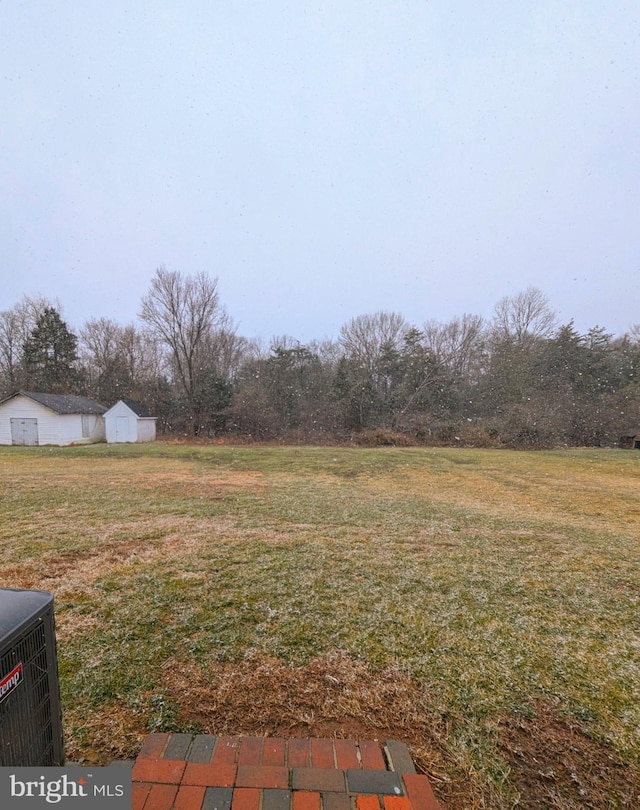 view of yard with central AC unit