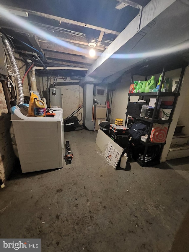 basement with washer / clothes dryer, water heater, and heating unit