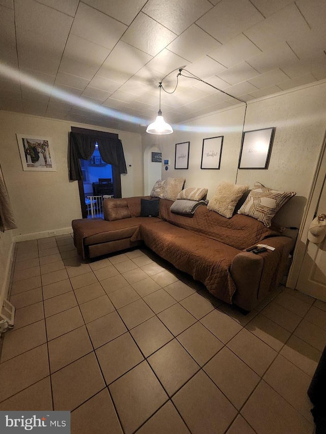 living room with tile patterned flooring