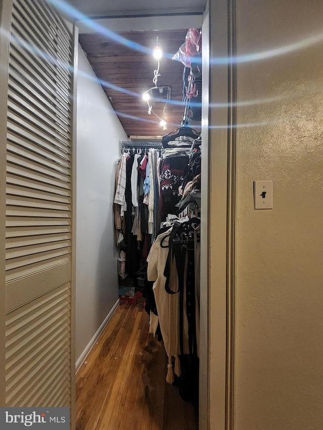 spacious closet featuring hardwood / wood-style floors