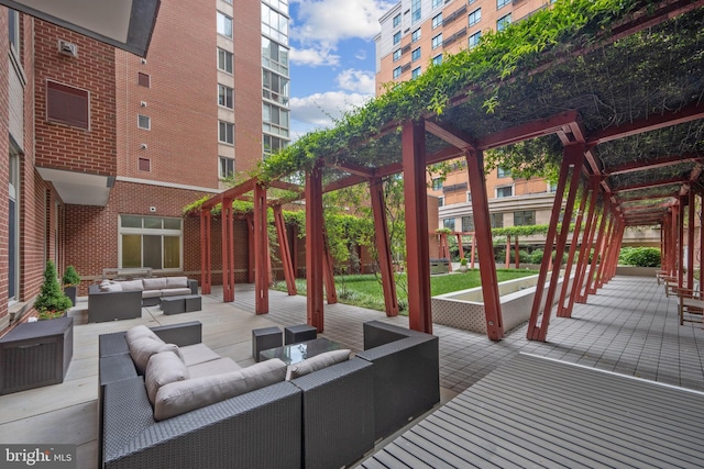 view of patio with a pergola and outdoor lounge area