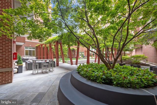 view of property's community featuring a patio area