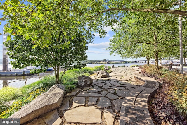 view of patio featuring a water view