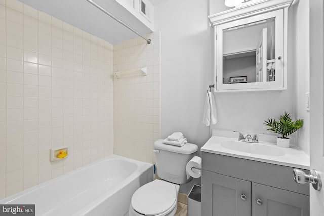 full bathroom with vanity, toilet, and tiled shower / bath combo