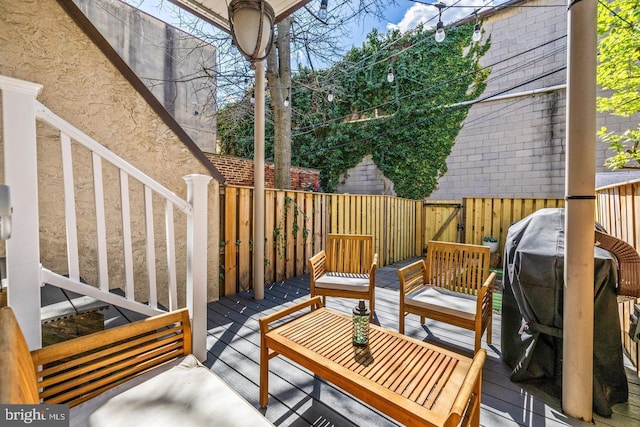 wooden deck with grilling area